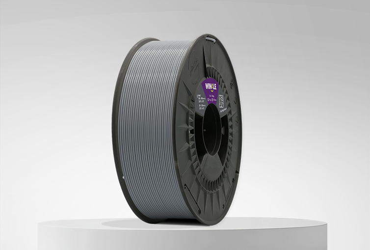 Spool of Winkle PLA High Speed Filament Ash Grey 1,75mm 1kg on a platform and gray background