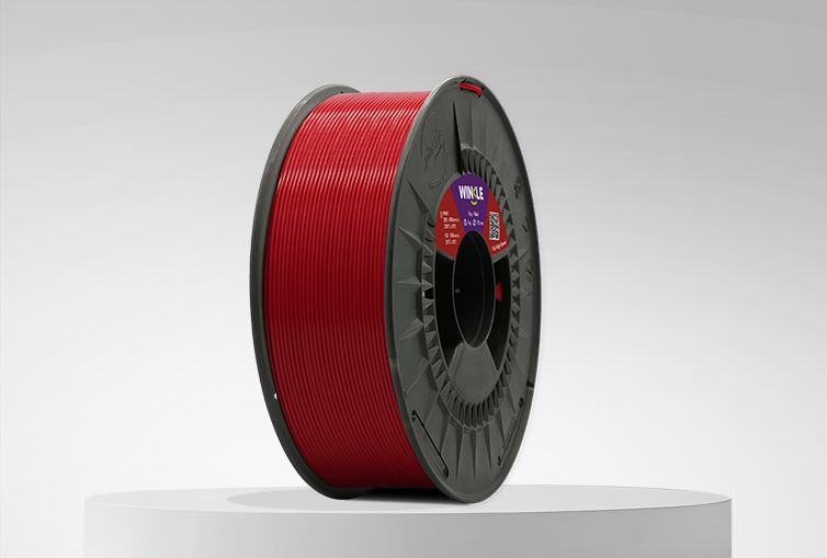 Spool of Winkle PLA High Speed Filament Devil Red 1,75mm 1kg on a platform and gray background