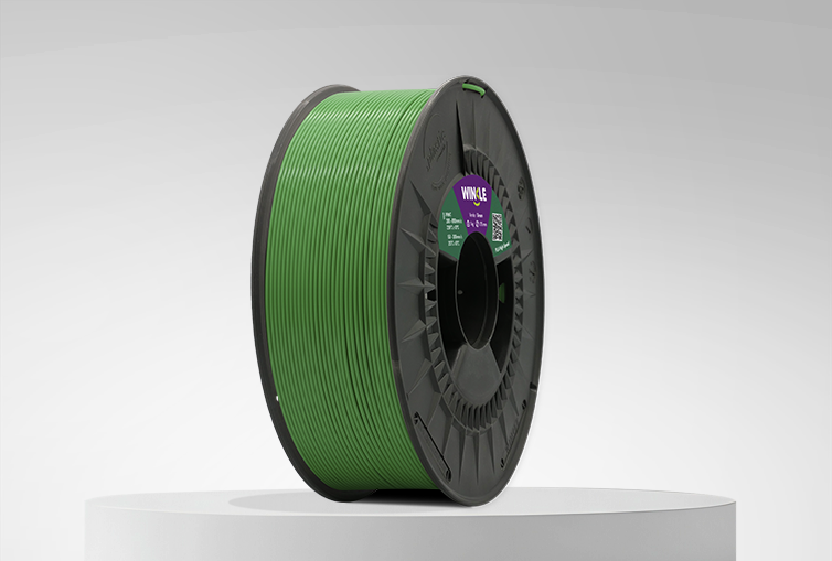 Spool of Winkle PLA High Speed Filament Avocado Green 1,75mm 1kg on a platform and gray background