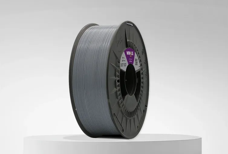 Spool of Winkle ASA Filament Ash Grey 1,75mm 1kg on a platform and gray background