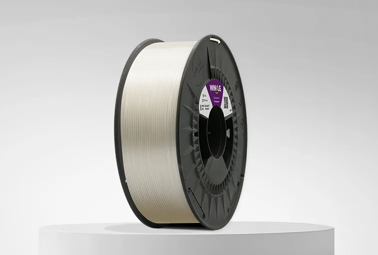 Spool of Winke PETG Filament Transparent 1,75mm 1kg on a platform and gray background