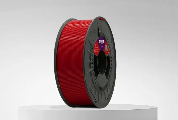 Spool of Winkle PLA HD Filament Devil Red 1,75mm 1kg on a platform and gray background