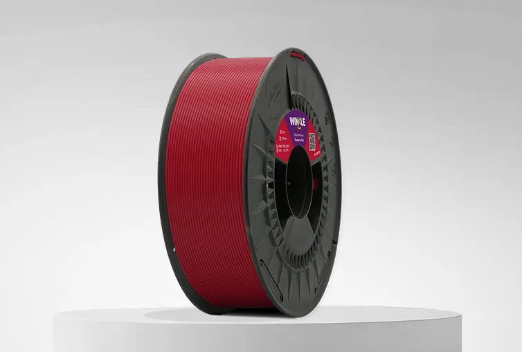 Spool of Winkle PLA Matte Filament Raspberry Red 1,75mm 1kg on a platform and gray background