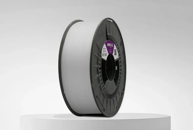 Spool of Winkle PP (Polypropylene) Filament Natural 1,75mm 1,5kg on a platform and gray background