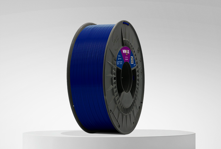 Spool of Winkle PLA HD Filament Royal Blue 1,75mm 1kg on a platform and gray background